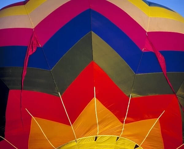 USA, Idaho, Teton Valley. The wildly-colored fabric of this hot-air balloon spices