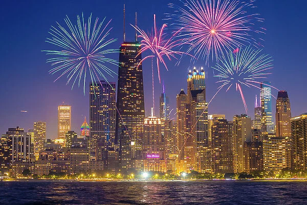 USA, Illinois, Chicago. Composite of downtown skyline and fireworks. (Editorial Use Only)
