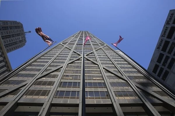 USA, Illinois, Chicago. The Hancock Building and American flags