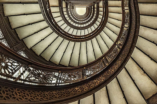 USA, Illinois, Chicago. Spiral staircase in Rookery Building designed by Frank Lloyd Wright. (Editorial Use Only)