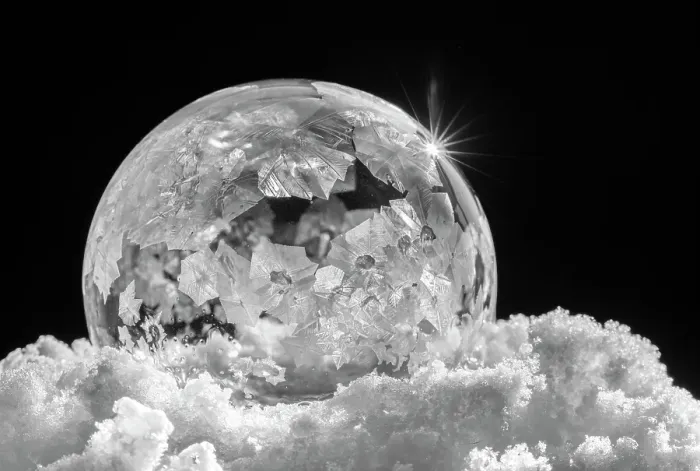 Framed Print : USA, Indiana, Carmel. Frozen soap bubble with feather-like crystals on bed of ice. ©Wendy Kaveney  /  Jaynes Gallery  /  DanitaDelimont.com