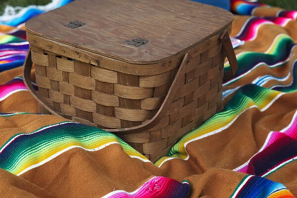 USA, Indiana, Indianapolis. Close-up of picnic basket and colorful blanket. Credit as
