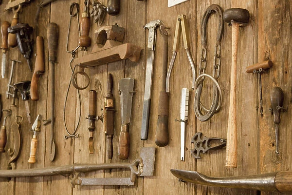 USA, Indiana, Indianapolis. Tools mounted on a wooden wall. Credit as: Wendy Kaveney