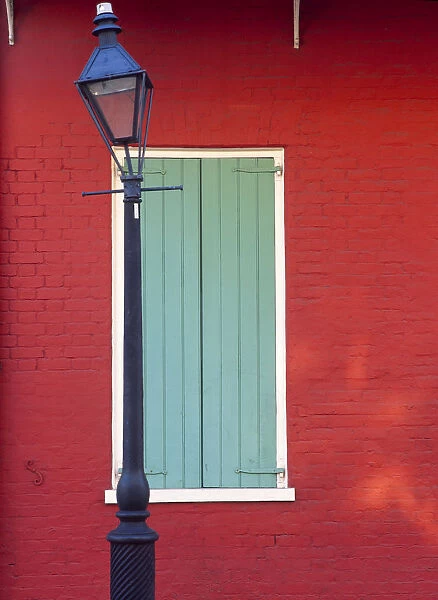 USA, Louisiana, New Orleans. Lamp post and window
