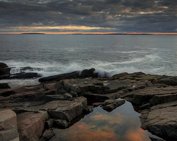 USA, Maine, Acadia National Park. Moody sunset on ocean coastline