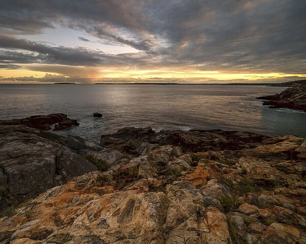 USA, Maine, Acadia National Park. Moody sunset on ocean coastline