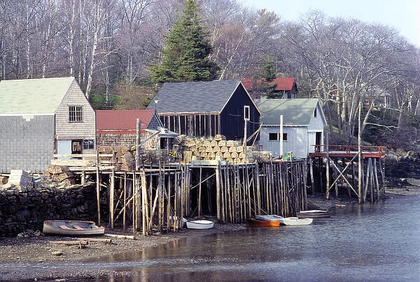 USA, Maine, Acadia NP. Lobster traps are stacked on the piers in a village near Acadia