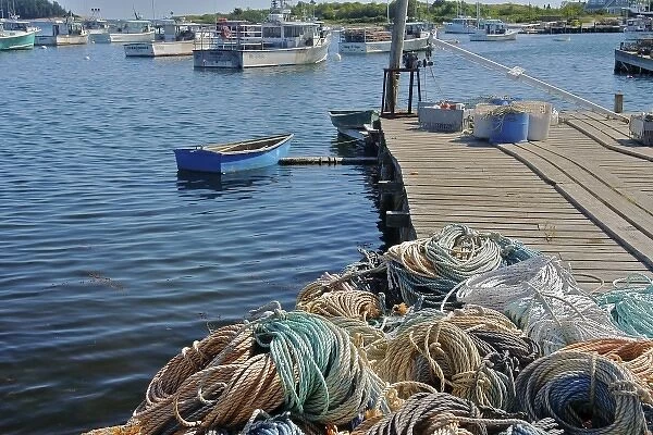 USA, Maine, Gouldsboro. Rope piled on a pier in a fishing village