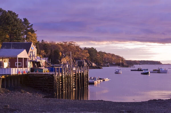 USA, Maine, Harpswell. Seafood restaurant on Lookout Point overlooks boats in bay at sunset