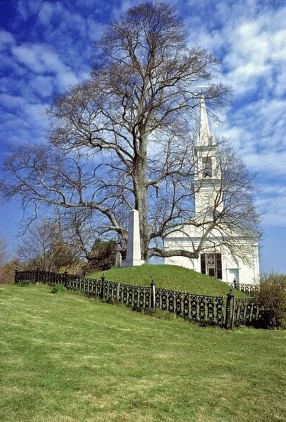 USA, Maine, Lincoln Co. An elegant, tall-steepled church shares a plot with a stately
