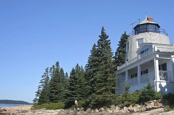 USA, Maine, Schoodic Peninsula. A home with a lighthouse-shaped tower above the rocky