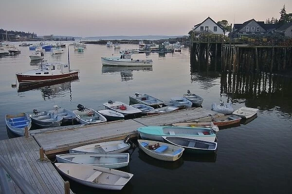 USA, Maine, Tremont. Rowboats, fishing boats, and lobster traps seen in the early