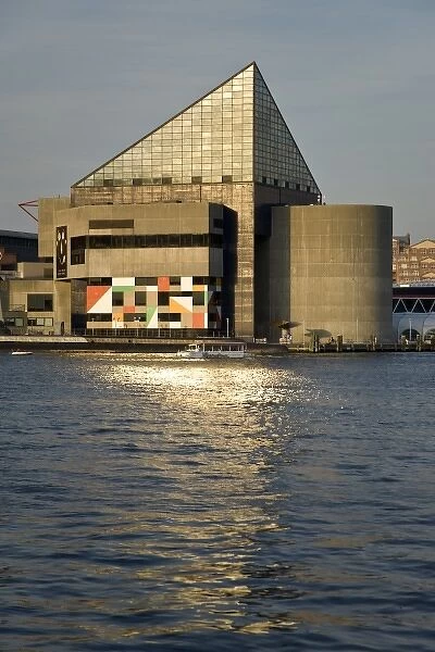 USA, Maryland, MD, Baltimore. The National Aquarium reflects in the Inner Harbor