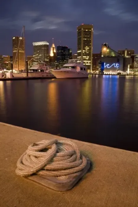 Framed Print : USA, Maryland, MD, Baltimore. A rope is coiled at a dock with the city reflected