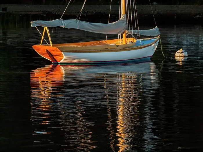 Framed Print : USA, Massachusetts, Cape Cod, Falmouth. Vintage sailboat moored in Quissett Harbor at sunset Framed Print : USA, Massachusetts, Cape Cod, Falmouth. Vintage sailboat moored in Quissett Harbor at sunset