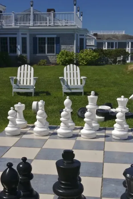 Framed Print : USA, Massachusetts, Chatham. Looking towards chairs and buildings from a giant chess