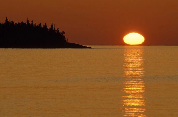 USA, Michigan, Isle Royale National Park, Spring sunrise silhouettes Edwards Island