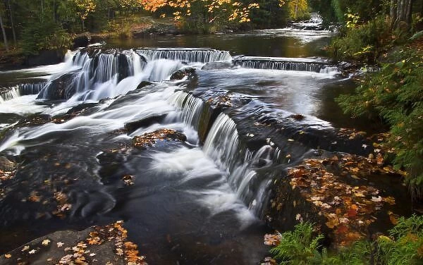 USA, Michigan, Upper Peninsula. Bond Falls and fall foliage