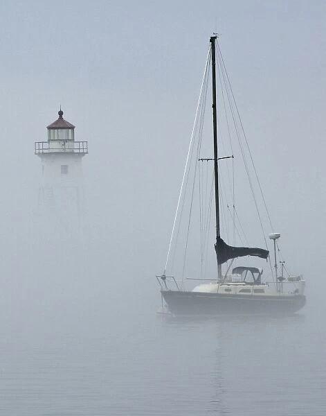 USA, Minnesota, Grand Marias. Sailboat in fog