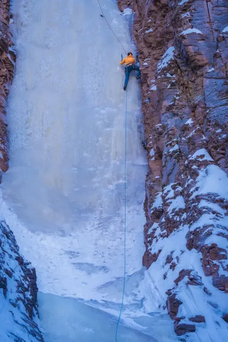 Framed Print : USA, Minnesota, Lake Superior. Climber scaling frozen waterfall on cliff