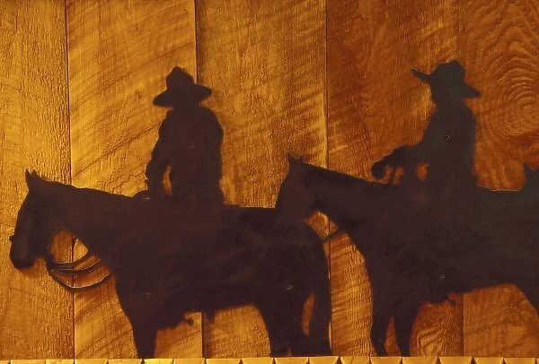 USA, Montana, Boulder River Cowboys on horses (iron sculpture) at Boulder River Ranch