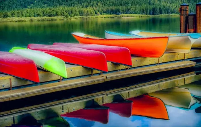 Framed Print : USA, Montana, Glacier National Park. Canoes on Swiftcurrent Lake at the Many Glacier