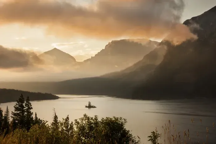 Framed Print : USA, Montana, Glacier National Park. Sunrise pierces clouds over St. Mary Lake. Credit as Framed Print : USA, Montana, Glacier National Park. Sunrise pierces clouds over St. Mary Lake. Credit as
