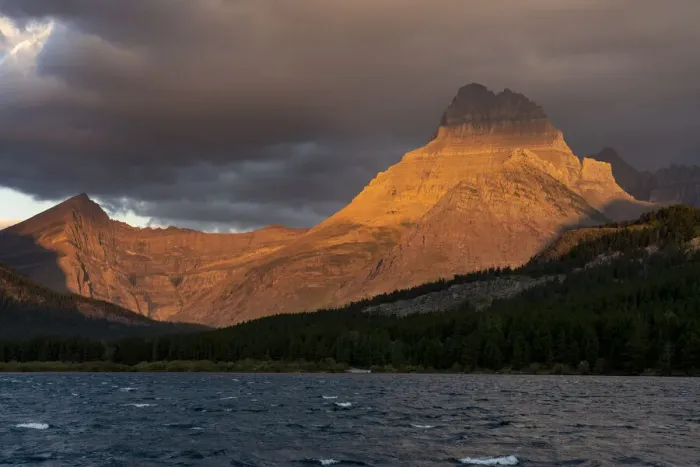 Framed Print : USA, Montana, Glacier National Park. Stormy sunrise on Mt Wilbur and lake Framed Print : USA, Montana, Glacier National Park. Stormy sunrise on Mt Wilbur and lake