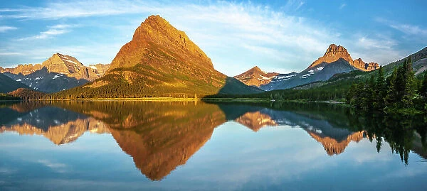 USA, Montana, Glacier National Park. Sunrise panoramic of lake and mountain