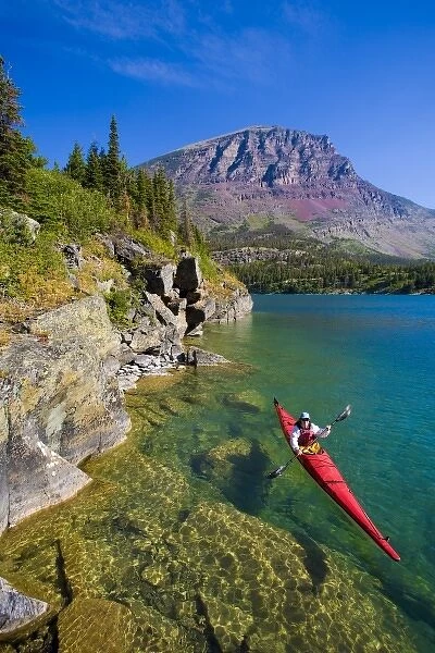 USA, Montana, Glacier National Park, Woman sea kayaker on St. Mary Lake. (MR)