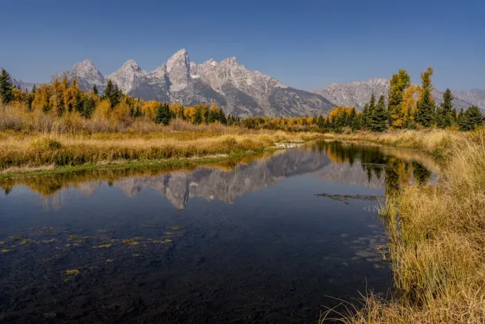 Framed Print : USA, Montana, Grand Teton National Park. Grand Teton Range and stream reflects in stream