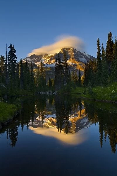 USA, Mt. Rainier National Park, Washington. Lenticular clouds reflected in Mirror
