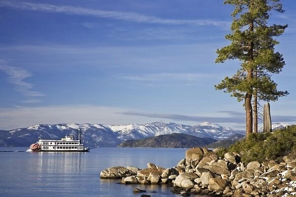 USA, Nevada, Lake Tahoe. A paddleboat moves across the lake