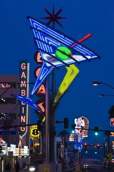 USA, Nevada, Las Vegas. Fremont East Area, neon casino signs, dusk