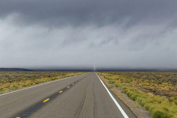 USA, Nevada. Road into approaching storm. Credit as: Don Paulson  /  Jaynes Gallery  /  DanitaDelimont