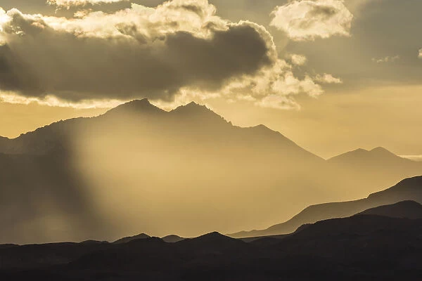 USA, Nevada, White Mountains. Sunset God rays over mountains