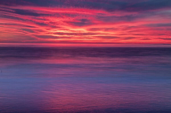 USA, New Jersey, Cape May. Multi-colored sunrise on ocean shore
