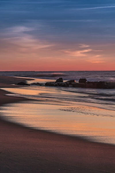 USA, New Jersey, Cape May National Seashore. Sunrise on winter shoreline. Credit as