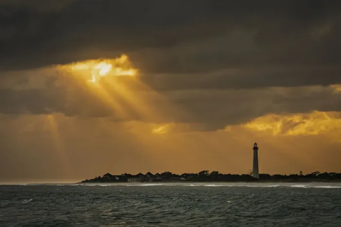 Framed Print : USA, New Jersey, Cape May National Seashore. Sunset on ocean shore and lighthouse Framed Print : USA, New Jersey, Cape May National Seashore. Sunset on ocean shore and lighthouse