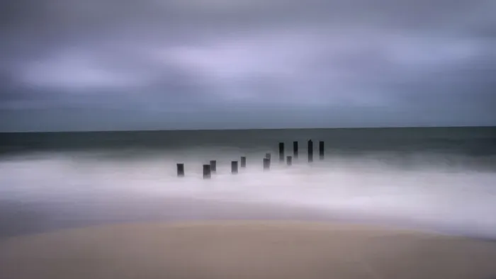 Framed Print : USA, New Jersey, Cape May National Seashore. Jetty supports and wave spry on beach Framed Print : USA, New Jersey, Cape May National Seashore. Jetty supports and wave spry on beach