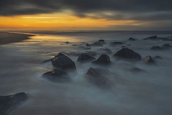 USA, New Jersey, Cape May National Seashore. Sunrise on rocky shoreline