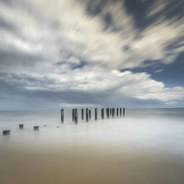 USA, New Jersey, Cape May National Seashore. Pier posts on beach
