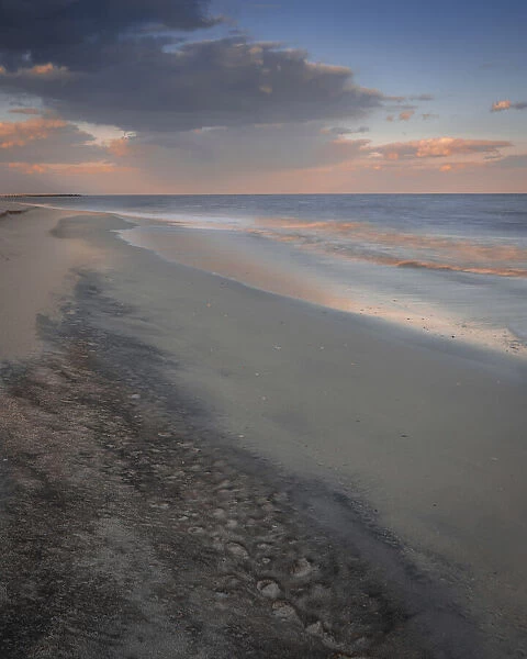 USA, New Jersey, Cape May National Seashore. Sunset reflections on ocean and beach