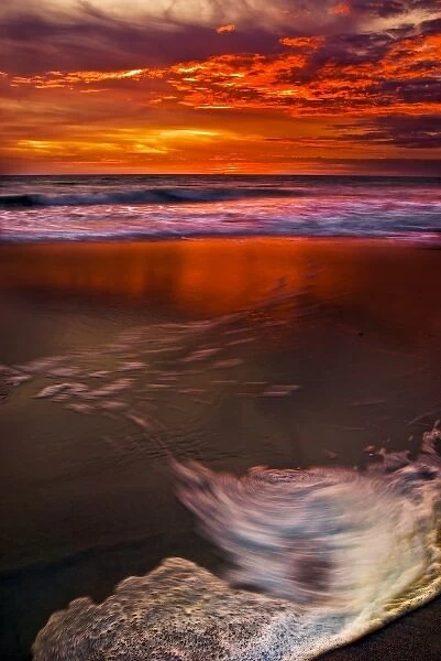 USA, New Jersey, Cape May. Sunset reflection on beach