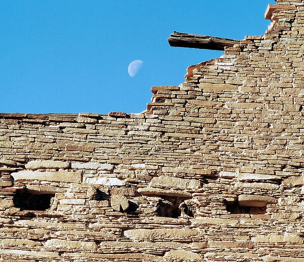 USA, New Mexico, Chaco Culture National Historical Park. Moon over a ruin at Chaco Canyon