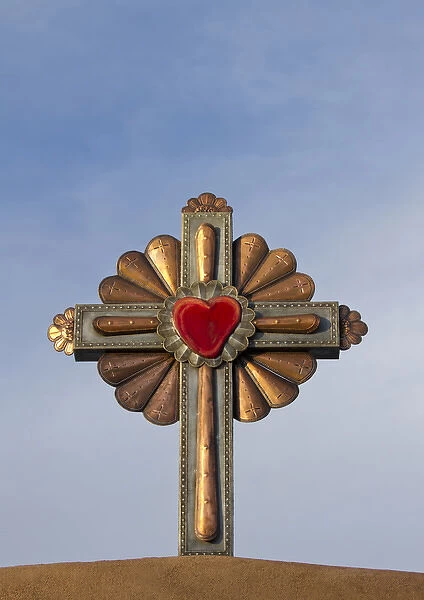 USA, New Mexico, Chimayo - Gilded cross atop of a roman catholic church in Chimayo