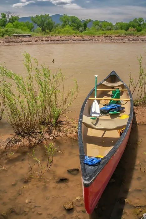 Framed Print : USA, New Mexico, Rio Grande River. Empty canoe on riverbank
