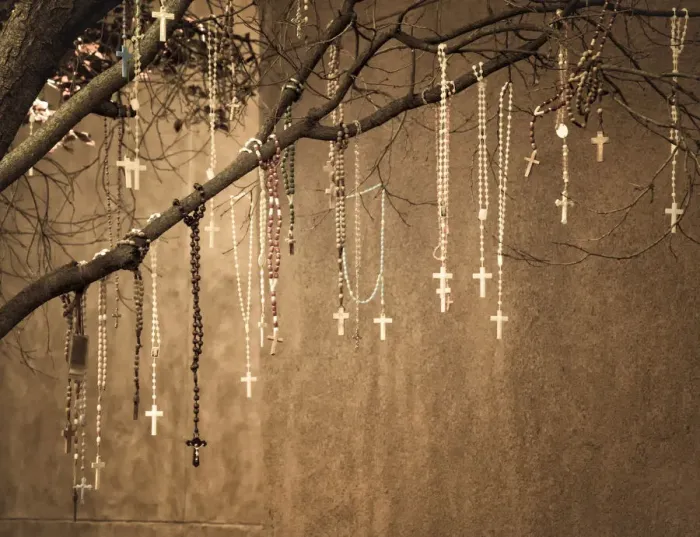Framed Print : USA, New Mexico. Rosaries hang from a tree outside of the Loretto Chapel in Santa Fe