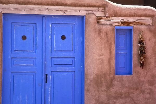 USA, New Mexico, Santa Fe. View of blue door and window in adobe structure