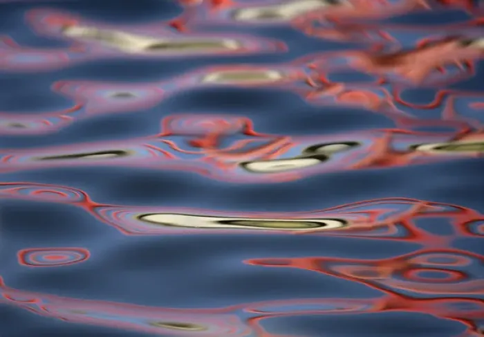 Framed Print : USA, New Mexico, Socorro. Bridge reflections create abstract swirling red patterns in water